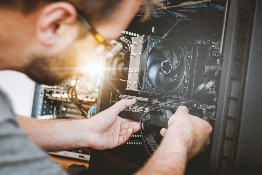 example of field services, where technician is repairing a computer and providing on-site IT support
